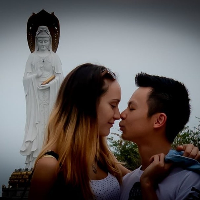 Jason and his wife at the Guanyin Buddhist statue