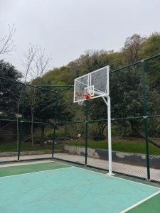 How to impress a woman: treat the approach like a pickup game. Outdoor basketball hoop in a park.