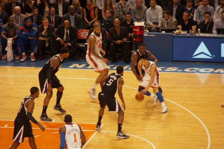 Jeremy Lin drives past Sacramento Kings defenders for the New York Knicks, February 2012.