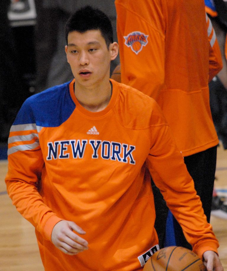 Jeremy Lin in a New York Knicks warm-up shirt with a basketball, March 2012.